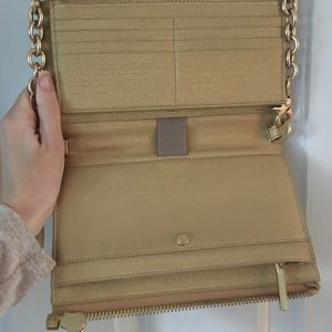 Gold Dagne Dover cross body wallet on a chain